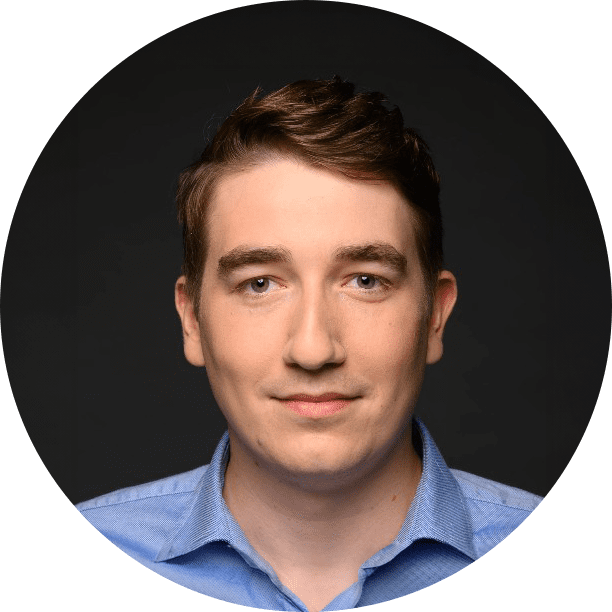 Mateusz Jędrocha, Chief Product Officer (CPO) at Adlook, in a professional headshot wearing a blue shirt against a dark background.