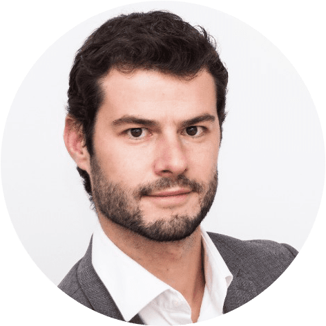Antoine Pietravalle, Head of Analytics and CSO at Adlook, in a professional headshot wearing a grey blazer and white shirt against a neutral background.